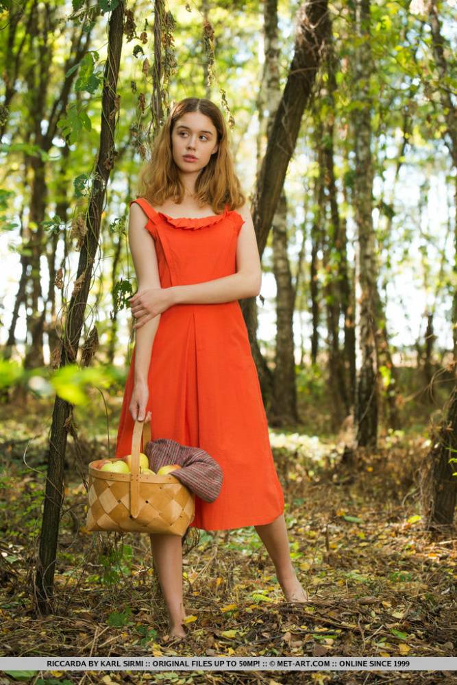 Sweet teen Riccarda takes off a dress to eat an apple while naked in a forest - #2