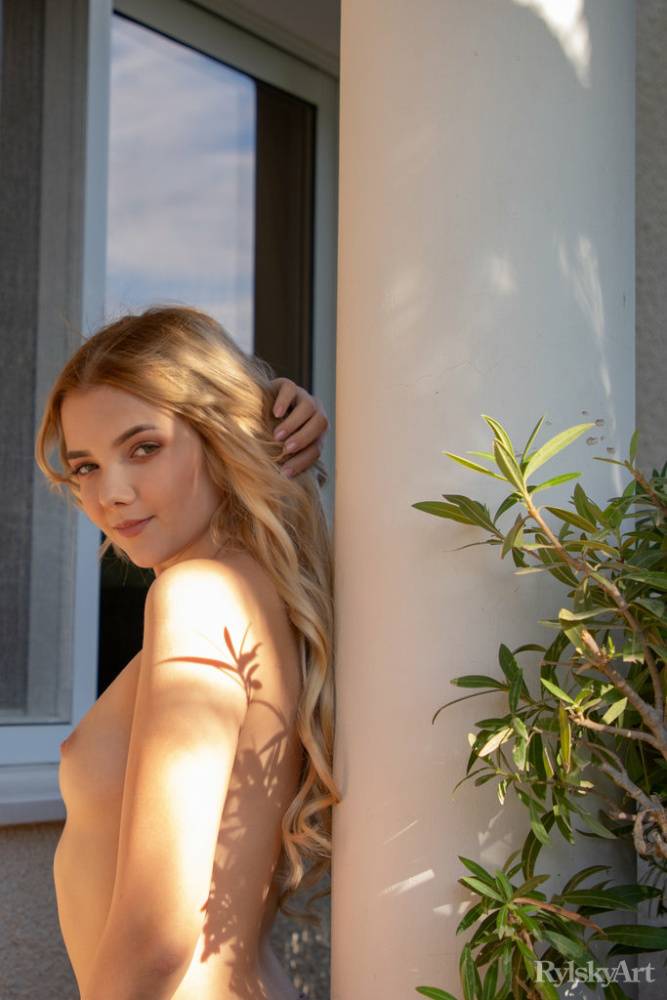 Young blonde Chanel Fenn shows her sexy ass while getting naked in a garden - #1