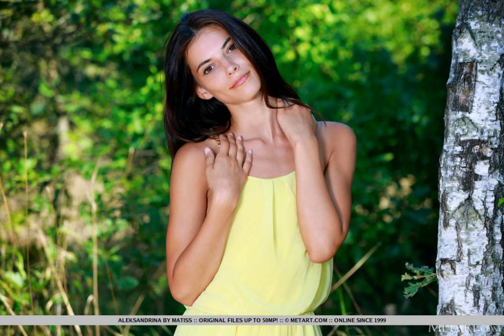 Nice teen Aleksandrina exposes her tan lined body by a hardwood tree - #11