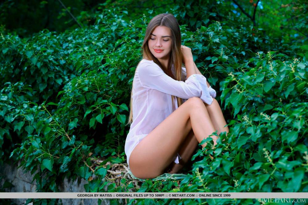 Sweet teen Georgia slips off her blouse to pose bare naked in a garden - #5