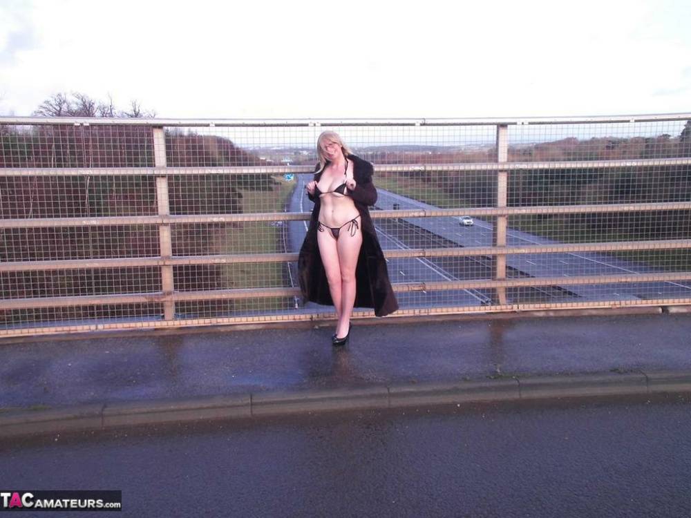 Older amateur Barby Slut flashes on a sidewalk upon an overpass - #4