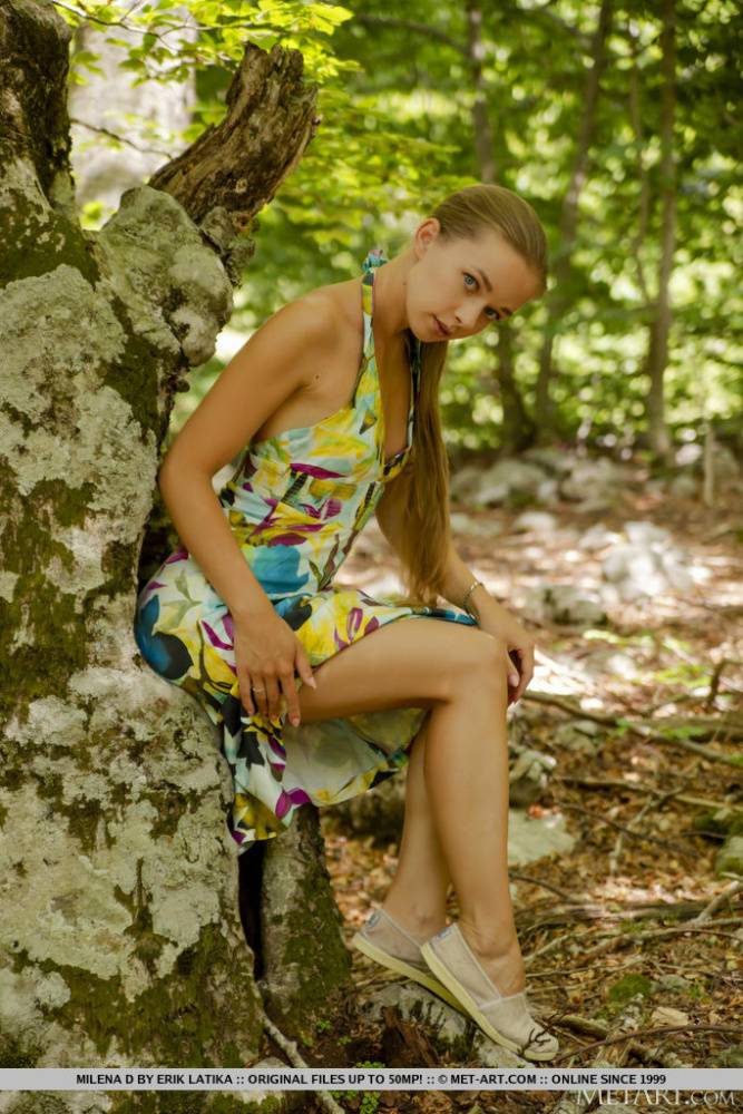Young blonde Milena D sports a long ponytail while getting naked in a forest - #10