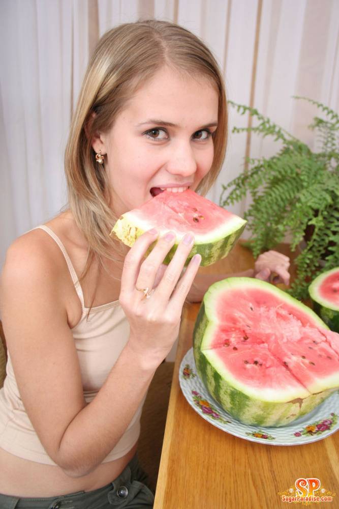 Angelic teen strips off her clothes to pose nude while eating a watermelon - #4
