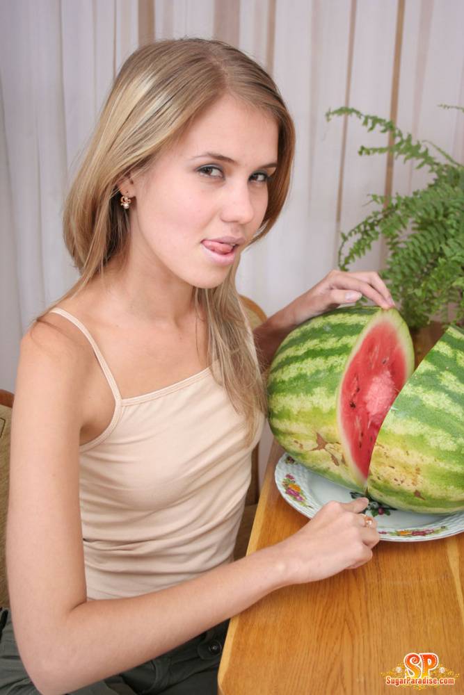 Angelic teen strips off her clothes to pose nude while eating a watermelon - #12