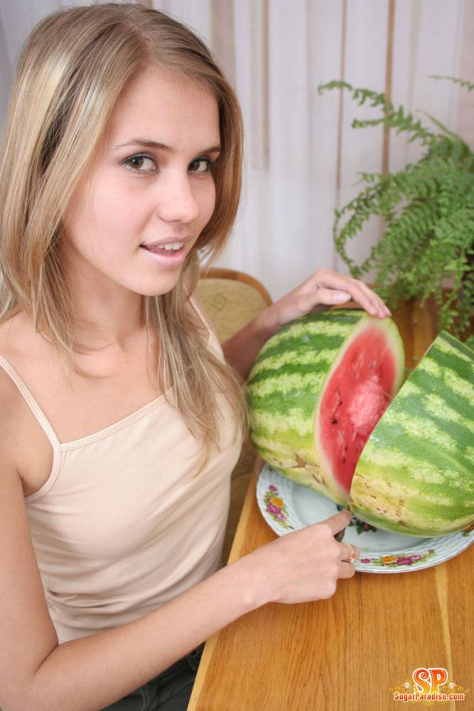 Angelic teen strips off her clothes to pose nude while eating a watermelon - #3