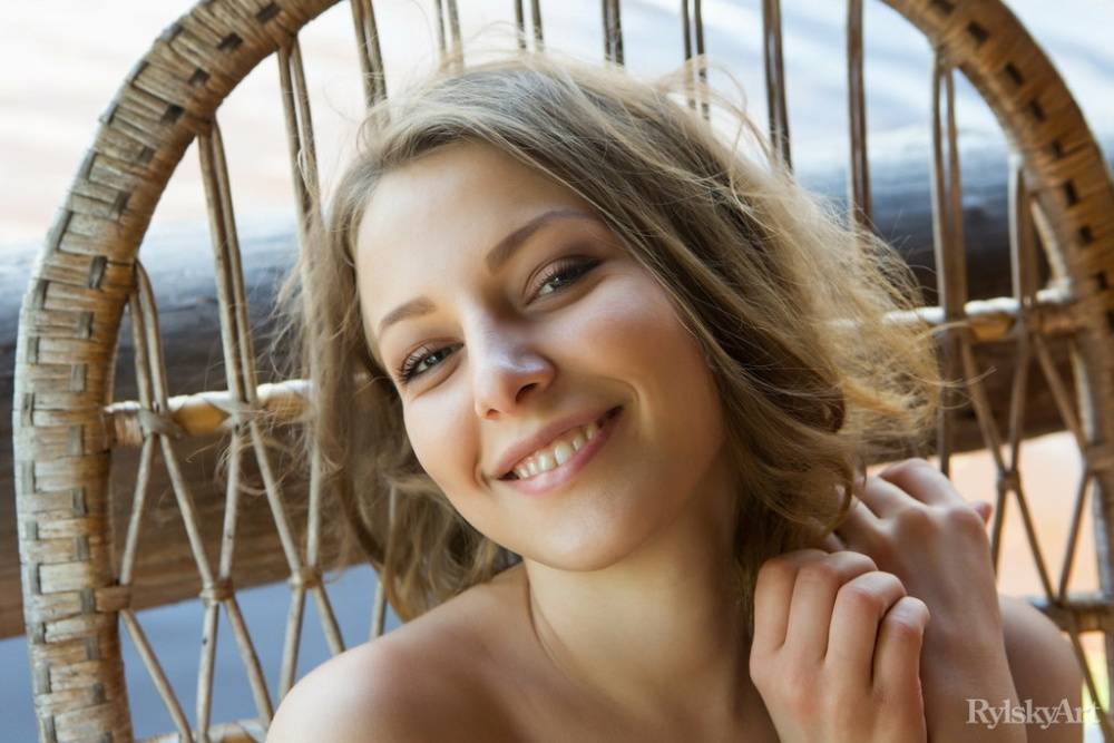 Beautiful girl Nikia gets totally naked on a seaside balcony by herself - #14