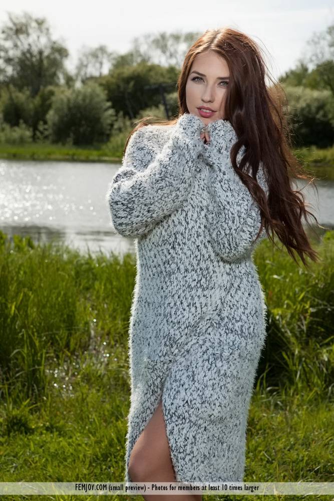 Beautiful teen Niemira releases her great body from a sweater dress in a field - #9