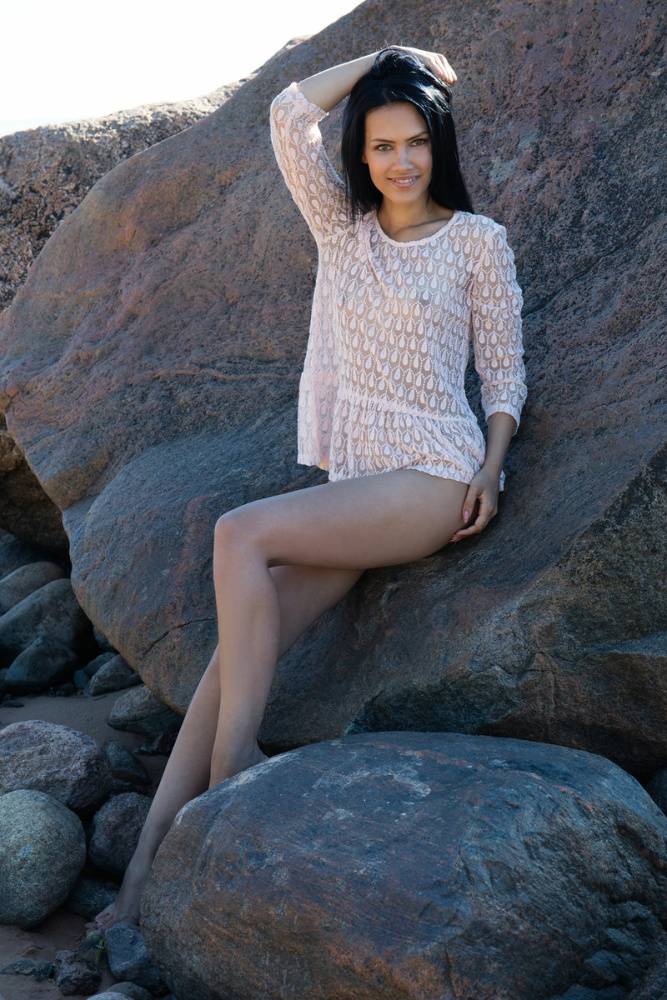 Dark haired teen Lada A models totally nude on rocks near the ocean - #12