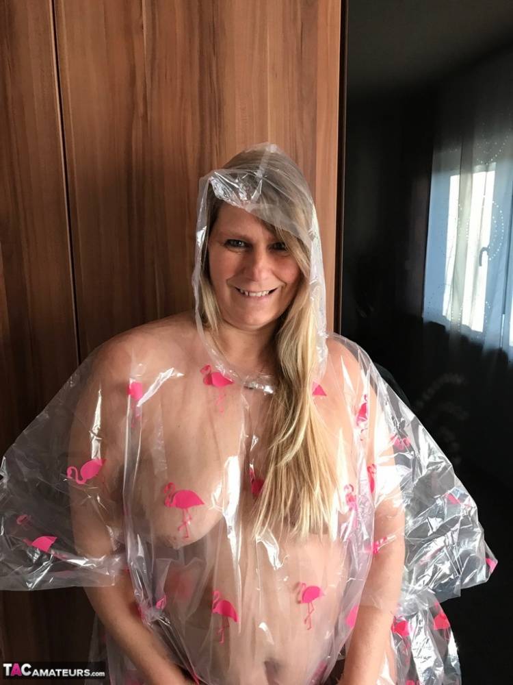 Thick amateur Sweet Susi poses nude while draped in a disposable raincoat - #15