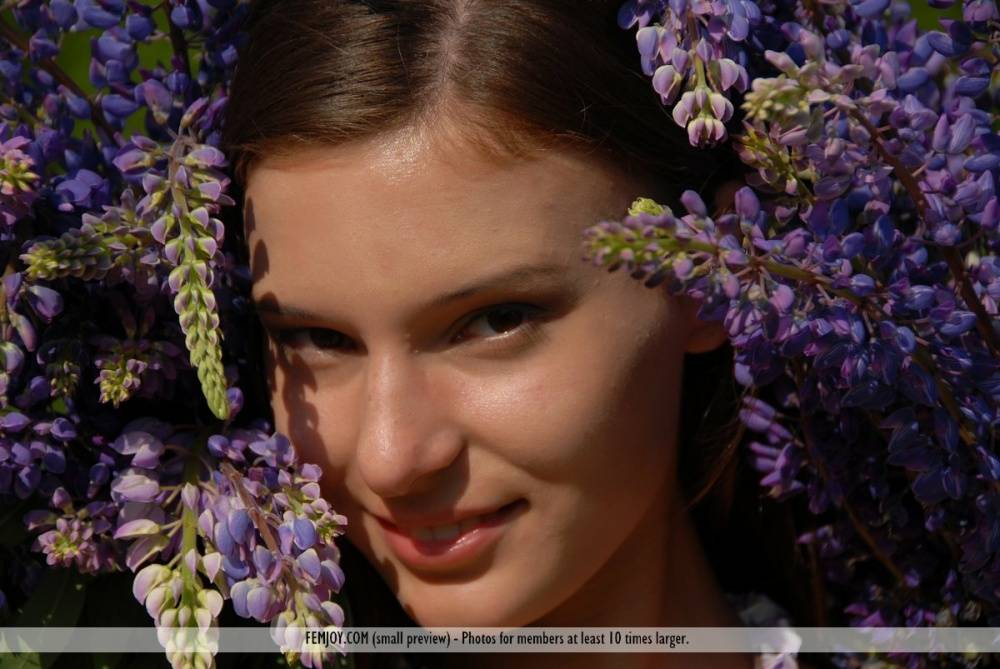 Completely naked teen Nikki D covers herself with petals from wildflowers - #4