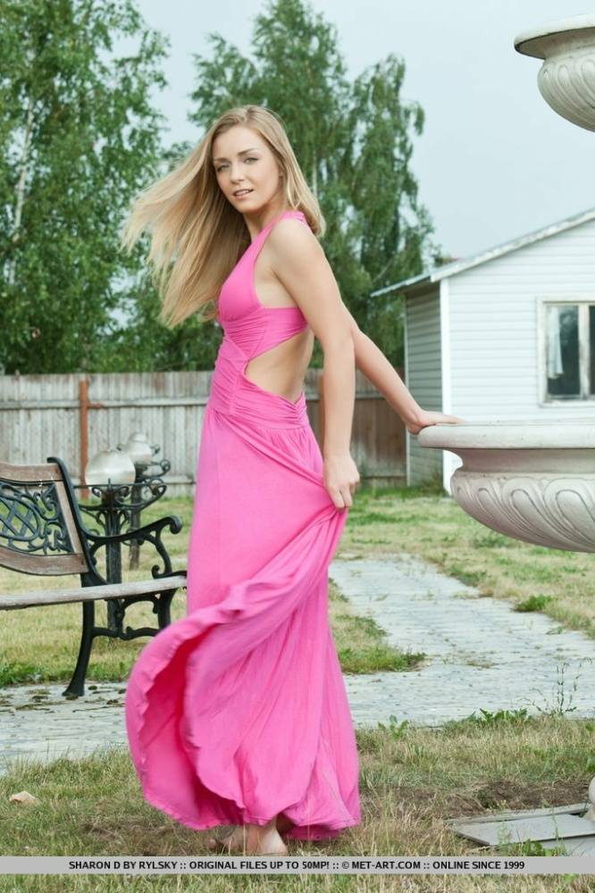 Blonde glamour model Sharon D flashing no panties up skirt in back yard - #15