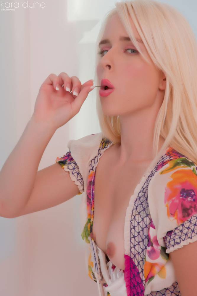 Petite blonde Kara Duhe eating a cherry with her dress open to show tiny tits - #14