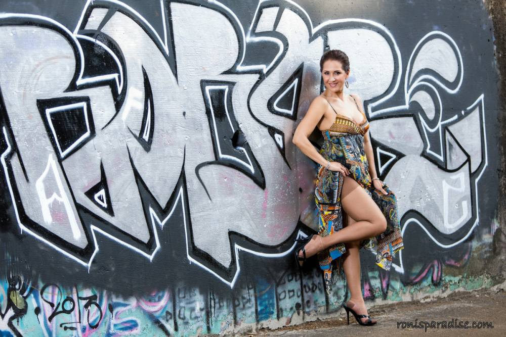 Mature wife Roni Ford removes dress and hose to model naked afore graffiti - #3