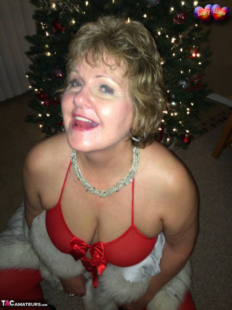 Older amateur Busty Bliss gives a blowjob in revealing lingerie at Christmas - #9