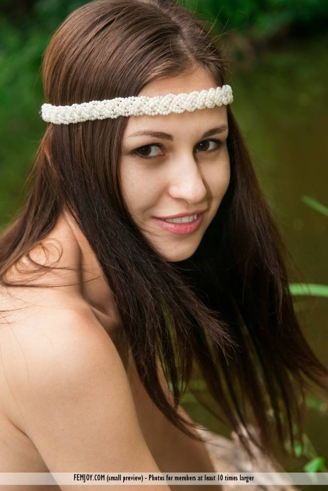 Sweet brunette Edessa G gets naked on windfall while wearing a headband - #4