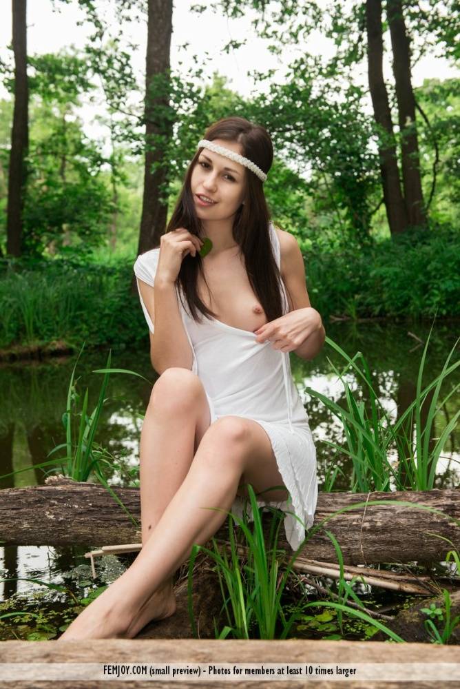 Sweet brunette Edessa G gets naked on windfall while wearing a headband - #7