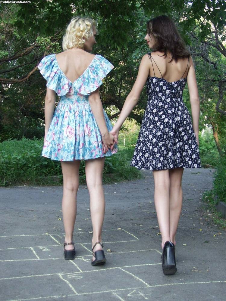 Young lesbians in summer dresses tongue kiss and lick pussy on a park pathway - #4