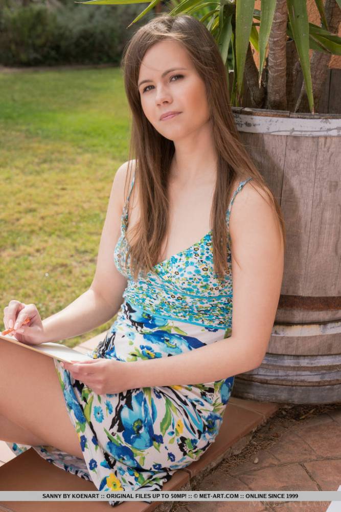 Caucasian teen Sanny doffs her dress to pose nude on a backyard patio - #9