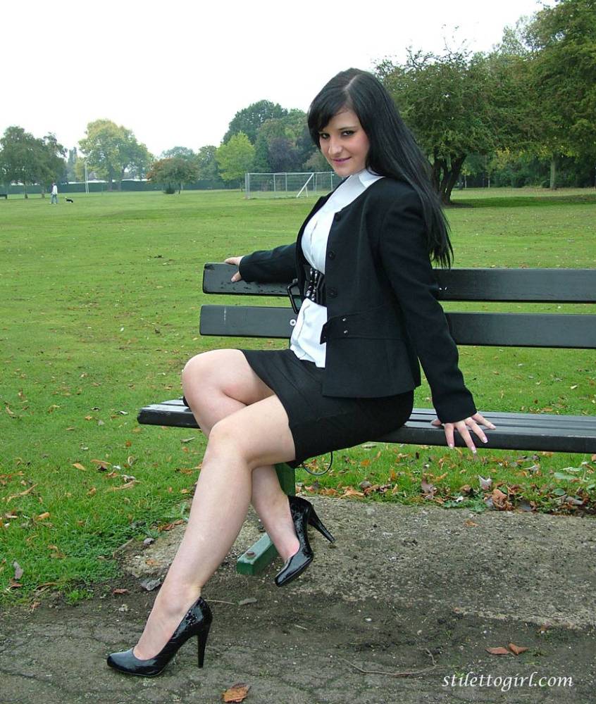 Fully clothed model Nicola takes a walk on park pathway in her new black pumps - #11