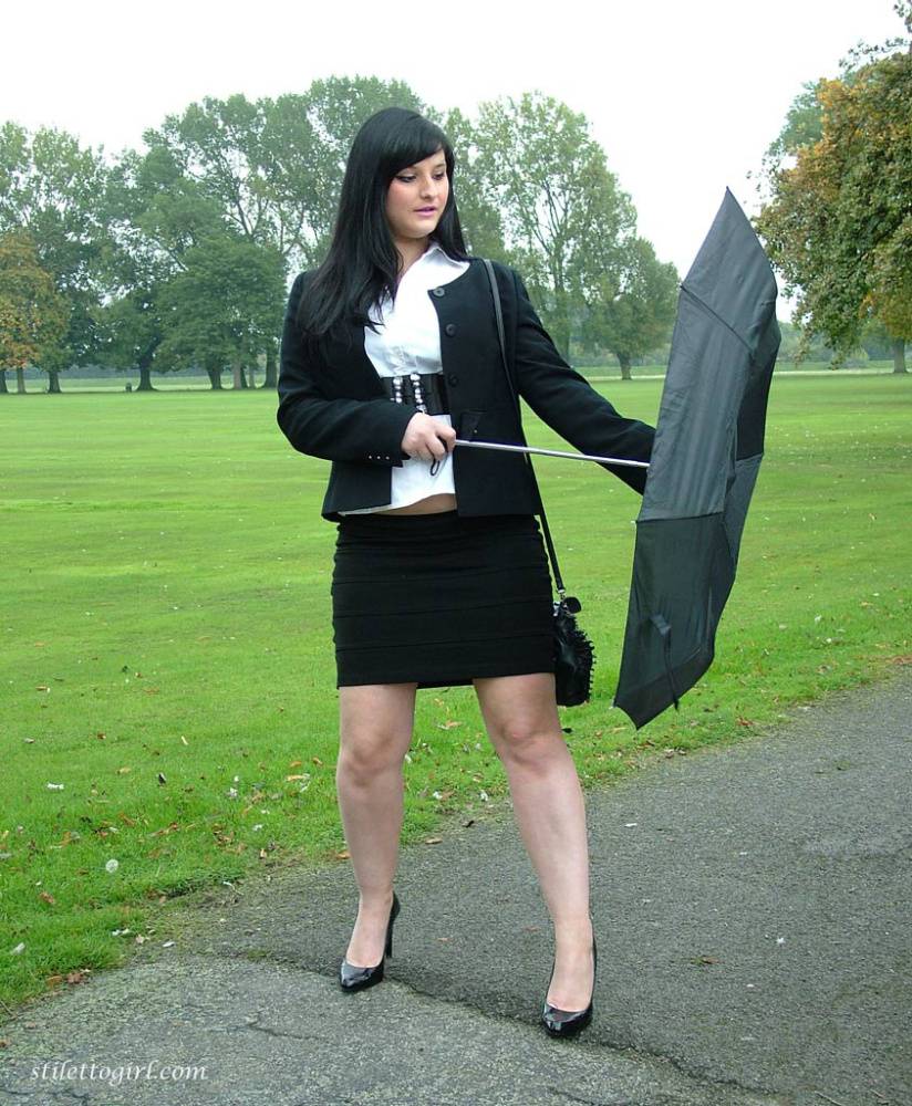 Fully clothed model Nicola takes a walk on park pathway in her new black pumps - #6