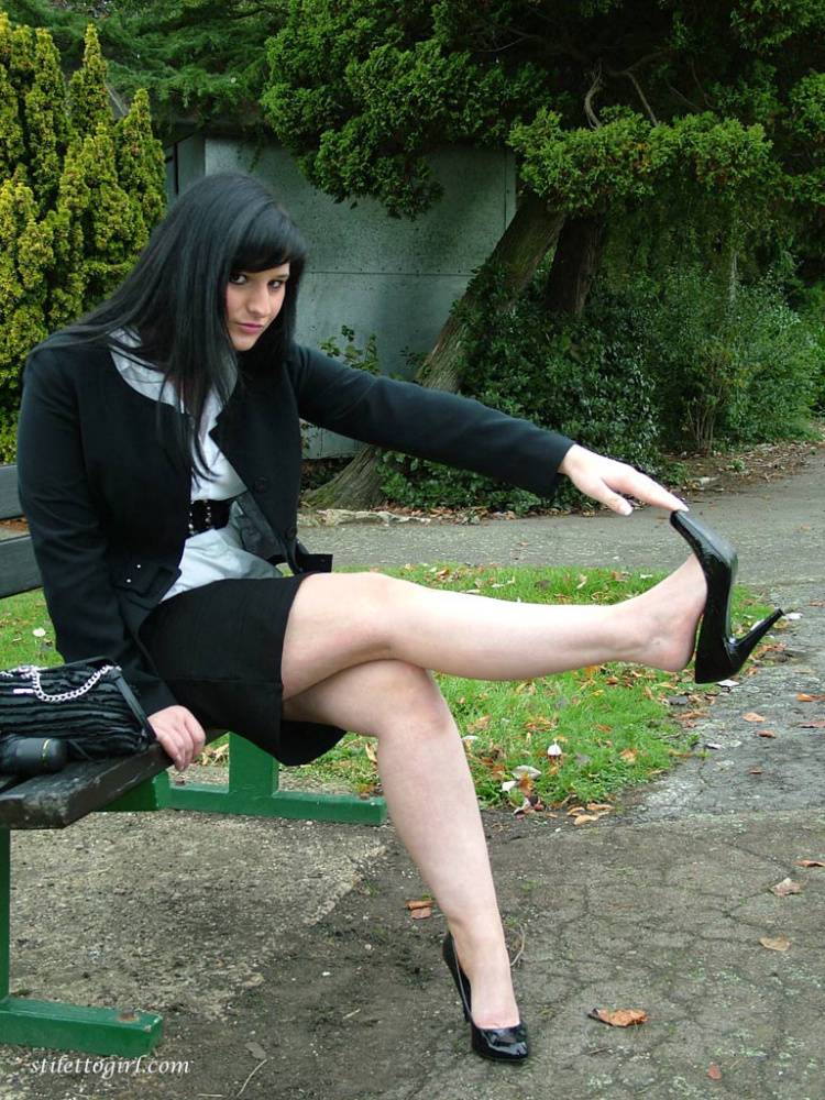 Fully clothed model Nicola takes a walk on park pathway in her new black pumps - #3