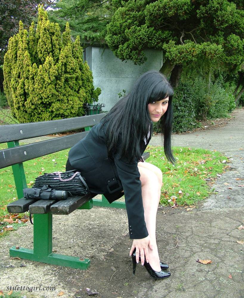 Fully clothed model Nicola takes a walk on park pathway in her new black pumps - #12