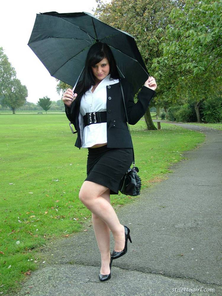 Fully clothed model Nicola takes a walk on park pathway in her new black pumps - #2