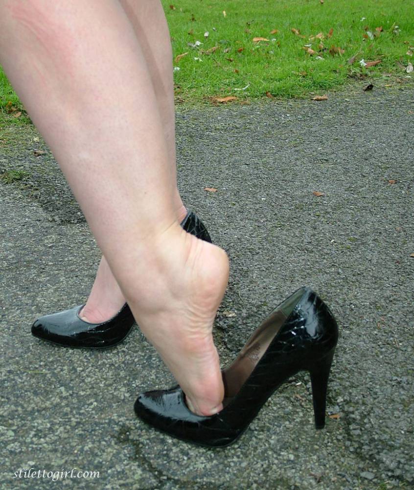 Fully clothed model Nicola takes a walk on park pathway in her new black pumps - #5