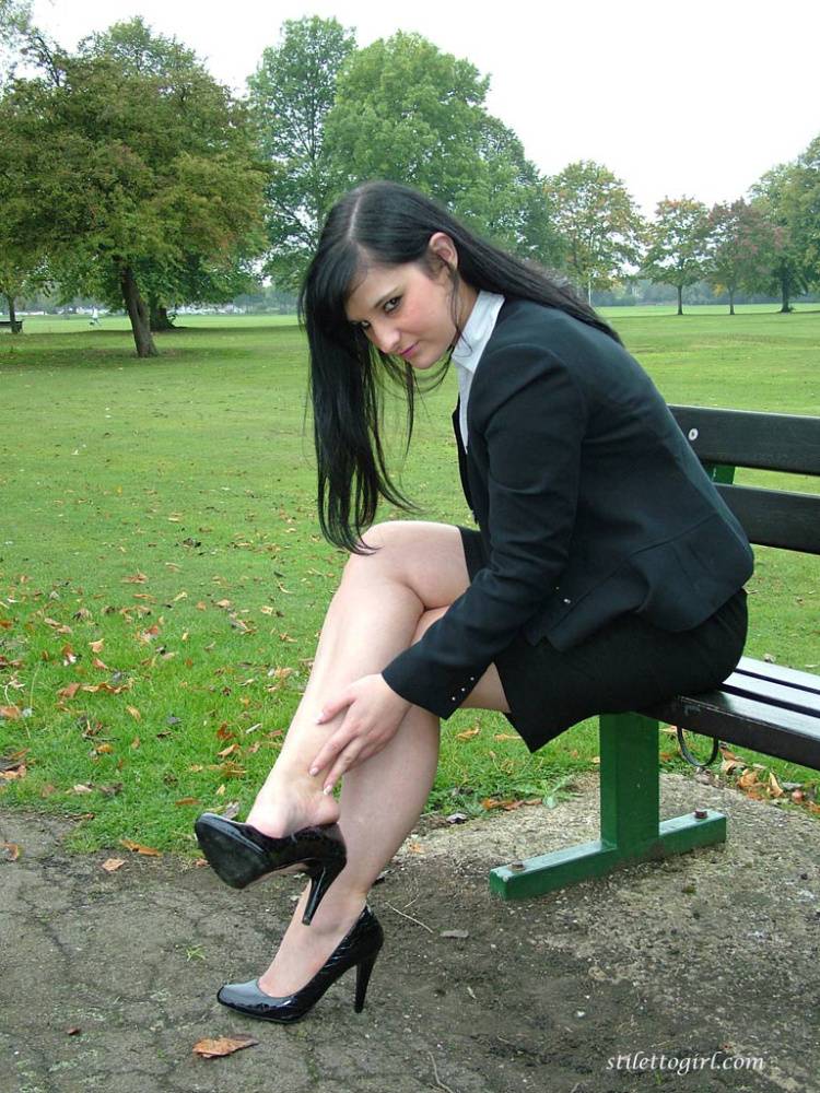 Fully clothed model Nicola takes a walk on park pathway in her new black pumps - #8