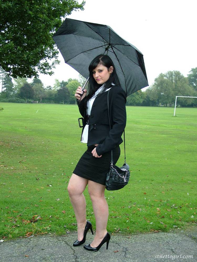 Fully clothed model Nicola takes a walk on park pathway in her new black pumps - #9