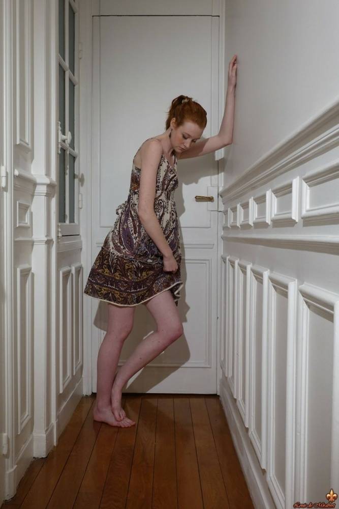 Pale redhead Nathalie Lawson exposes her upskirt underwear in a hallway - #8