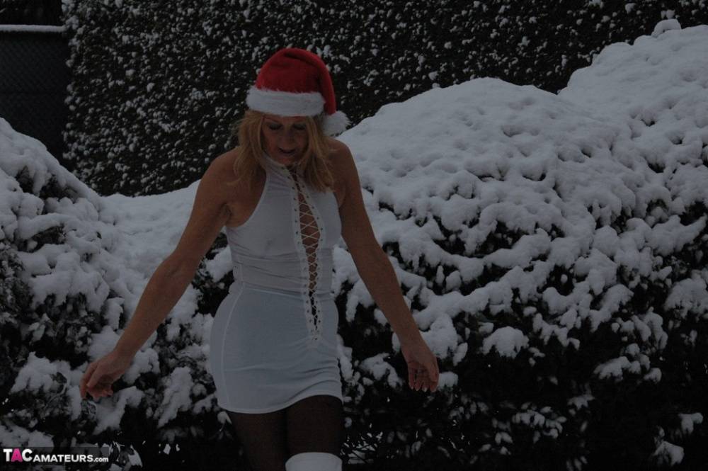Old blond Kyras Nylons models white 3 piece lingerie after coming in from snow - #6