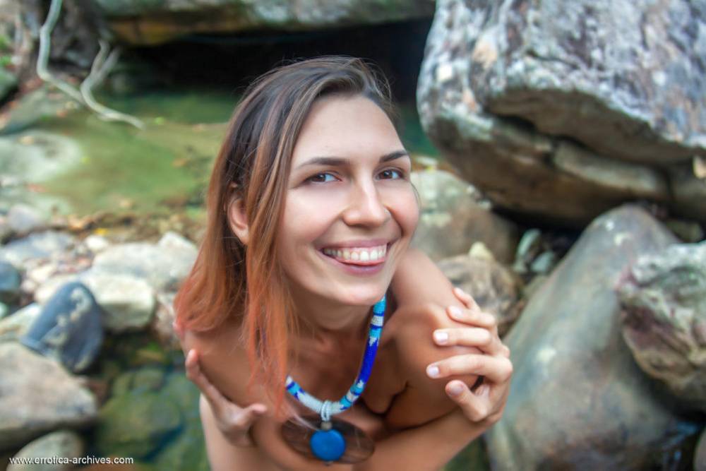 Skinny teen Noelia models in the nude while in a pool of water - #16