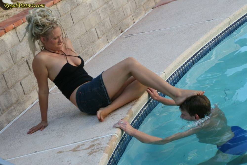 Foot fetish subs worship legs of a femdom bitch in a skirt by a pool - #7