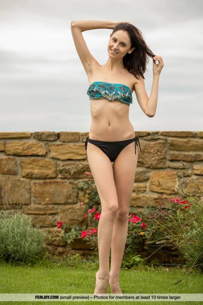 Leggy teen Sabrina G doffs a bikini to model naked on a garden wall - #13