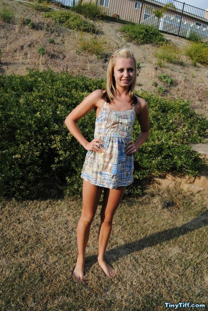 Blond amateur Tiny Tiff removes a summer dress and thong to stand nude outside - #1