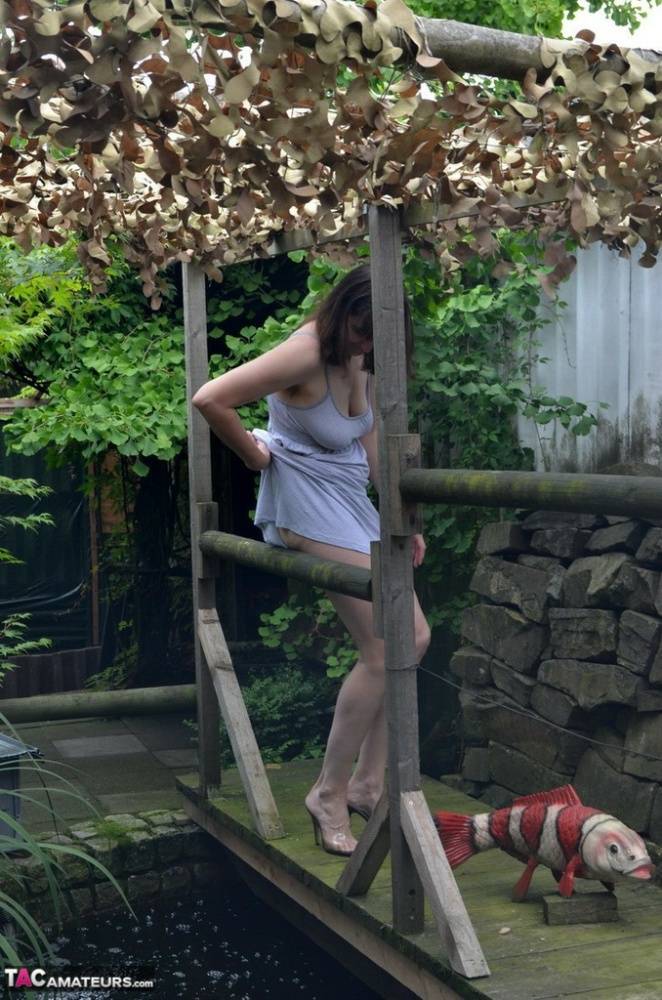 Amateur woman Hot MILF gets totally naked on a footbridge in the backyard - #13