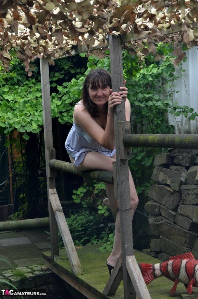 Amateur woman Hot MILF gets totally naked on a footbridge in the backyard - #7