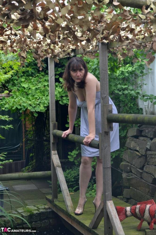 Amateur woman Hot MILF gets totally naked on a footbridge in the backyard - #15