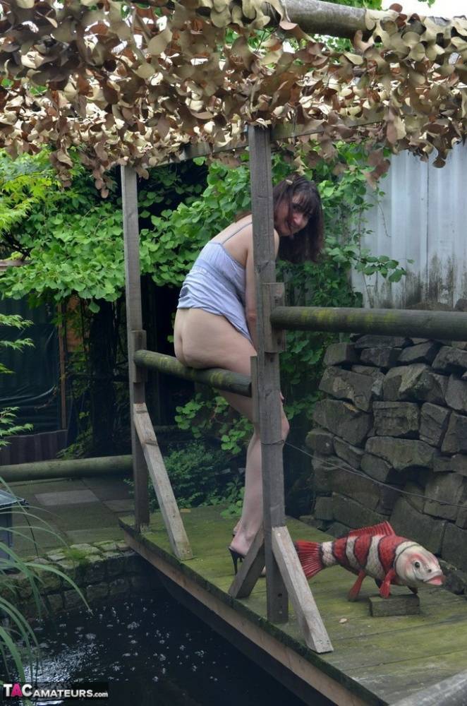 Amateur woman Hot MILF gets totally naked on a footbridge in the backyard - #12