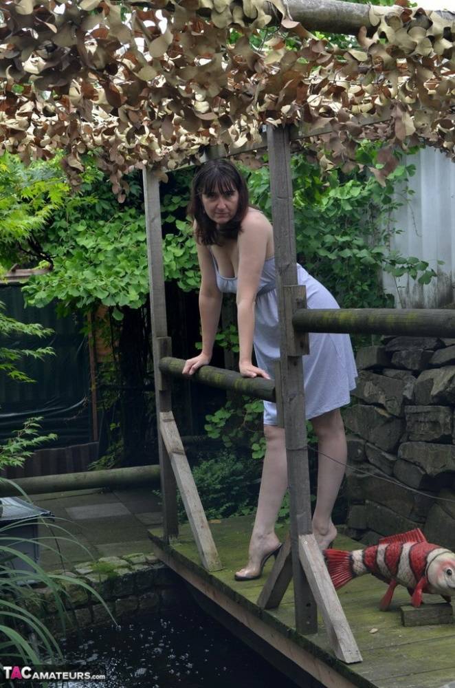 Amateur woman Hot MILF gets totally naked on a footbridge in the backyard - #3