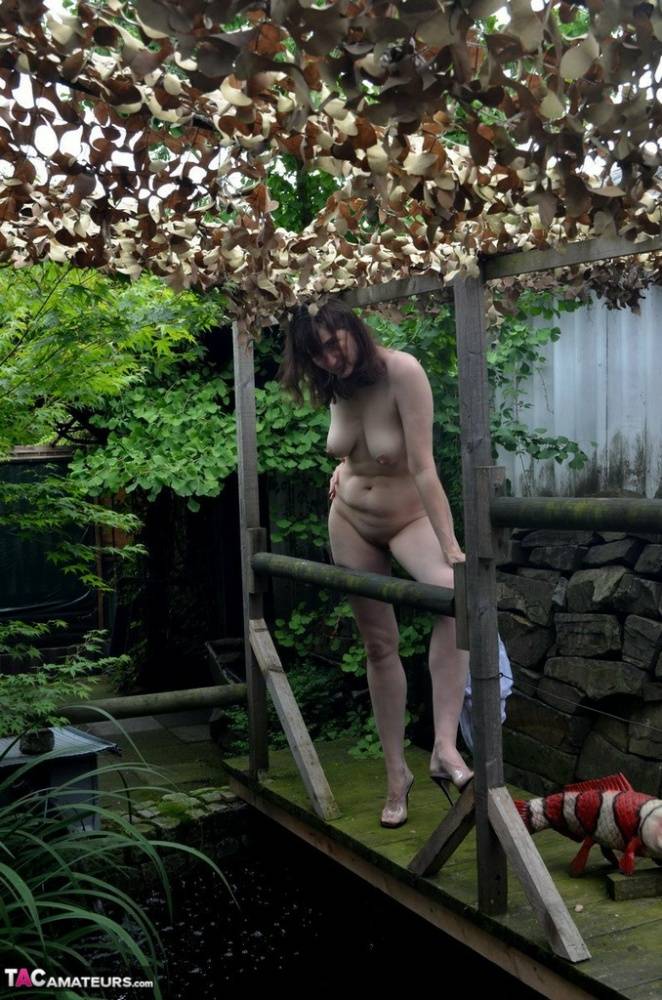 Amateur woman Hot MILF gets totally naked on a footbridge in the backyard - #8