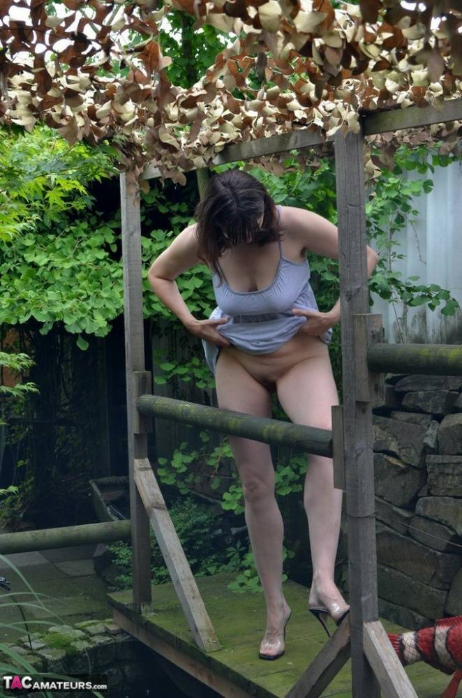 Amateur woman Hot MILF gets totally naked on a footbridge in the backyard - #10