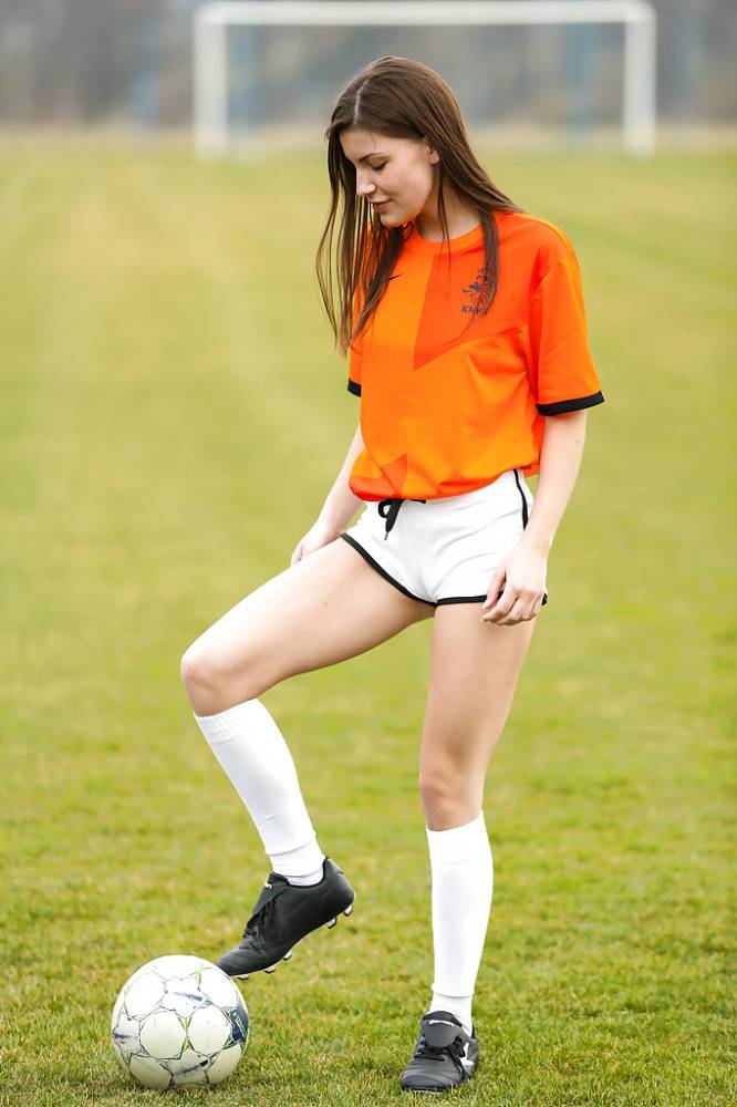 Lilly P is undressing her soccer uniform while on the field with a ball - #7