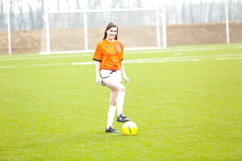 Lilly P is undressing her soccer uniform while on the field with a ball - #15