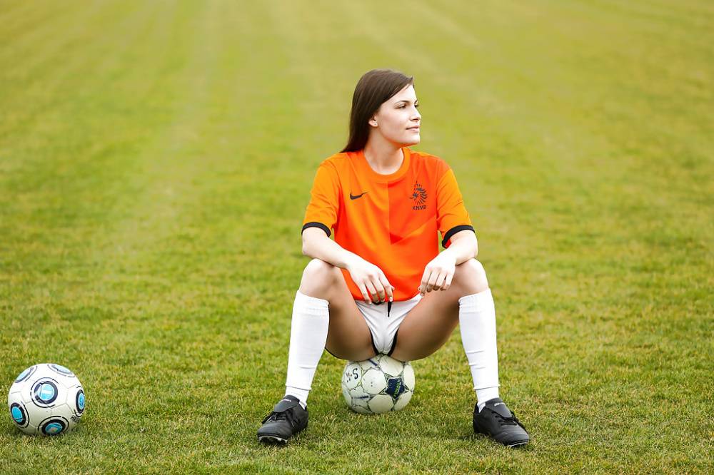 Lilly P is undressing her soccer uniform while on the field with a ball - #12