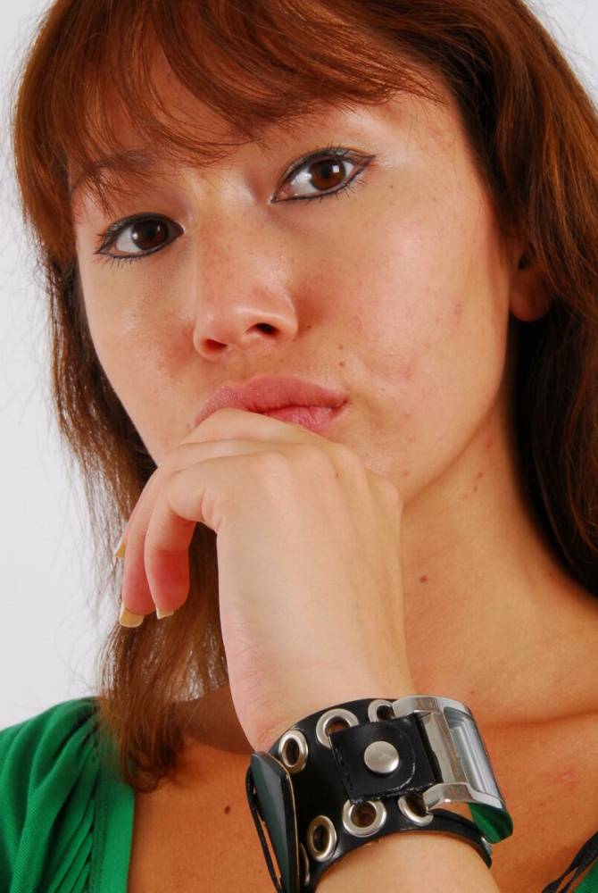 Redheaded Asian girl Evita models a Guess style cuff watch during SFW action - #7