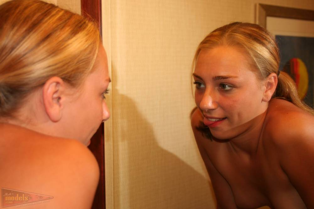Young blonde Krista looks in a mirror after getting completely naked - #2
