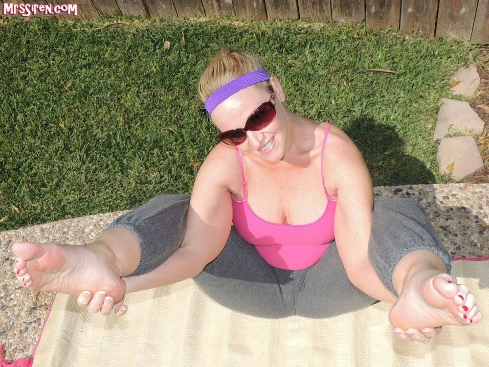 Barefoot BBW Dee Siren bares her boobs and big butt while doing yoga by a pool - #5