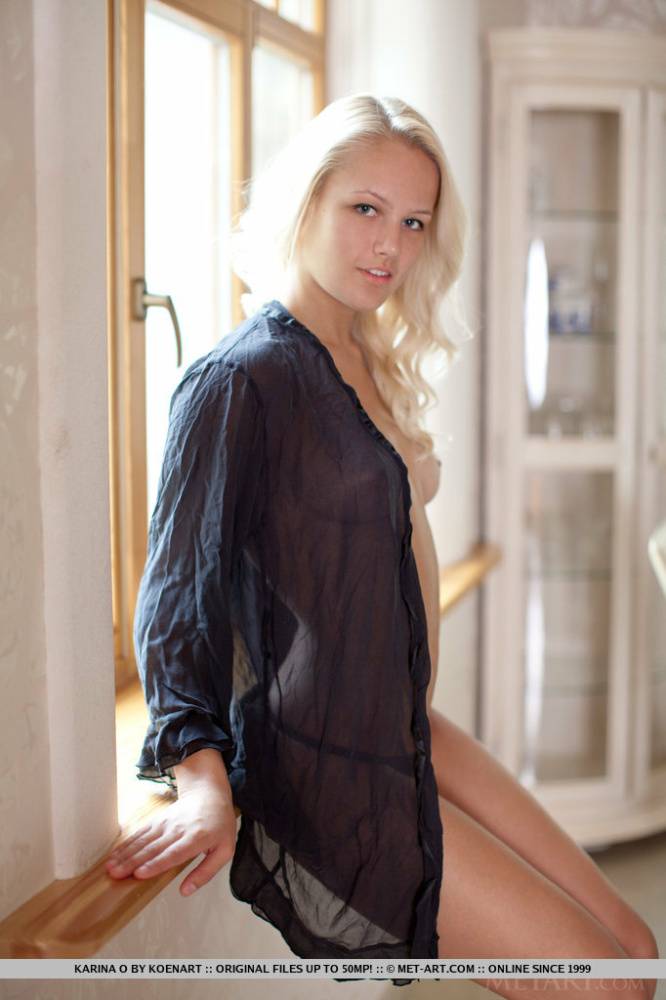 Natural blonde Karina O frees her hard teen body from a black shirt and thong - #5